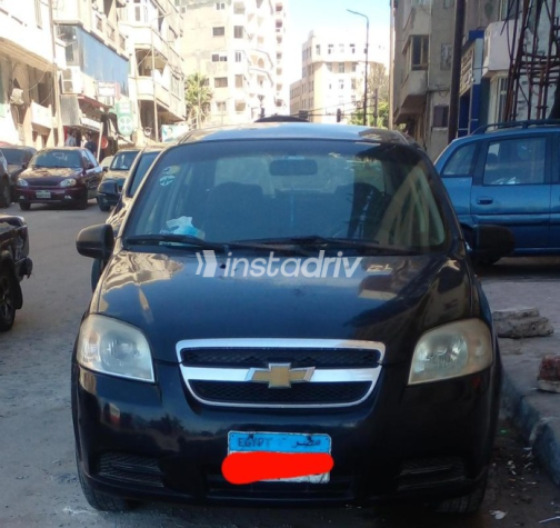 شيفروليه افيو 2009 أسود يدوي مستعملة للبيع في الإسكندرية - 1