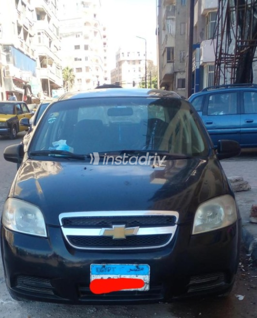 شيفروليه افيو 2009 أسود يدوي مستعملة للبيع في الإسكندرية - 2