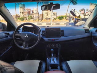 ميتسوبيشي لانسر 2015 أحمر أوتوماتيك مستعملة للبيع في أسيوط