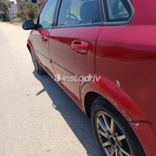 Chevrolet Optra 2010 Dark Red Automatic Used for Sale in Shibin El Qanater - 9