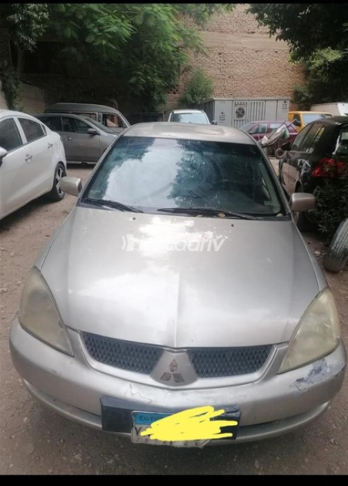 Mitsubishi Lancer 2004 Champagne Manual Used for Sale in Giza - 1