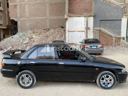Mitsubishi Lancer 1992 Black Manual Used for Sale in Cairo - 4