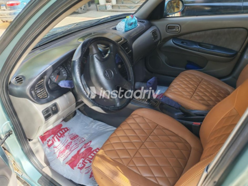 Nissan Sunny 2002 Olive Green Automatic Used for Sale in Ashmoun - 5
