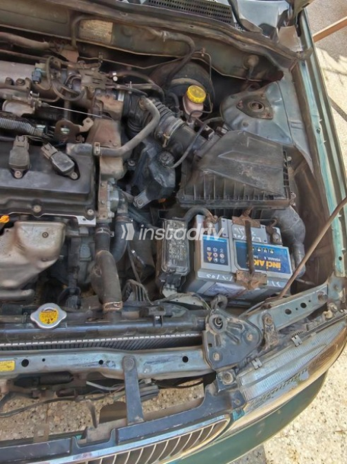 Nissan Sunny 2002 Olive Green Automatic Used for Sale in Ashmoun - 8