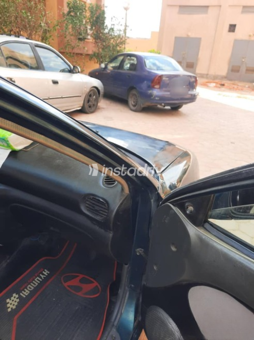 Hyundai Accent 1999 Green Manual Used for Sale in Hadayek October - 7