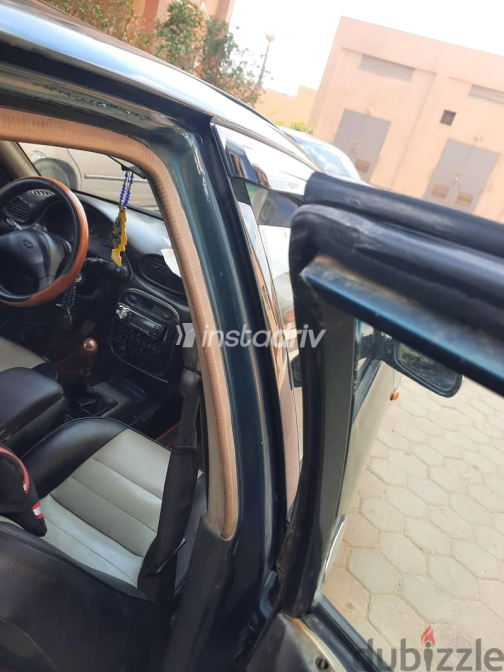Hyundai Accent 1999 Green Manual Used for Sale in Hadayek October - 8