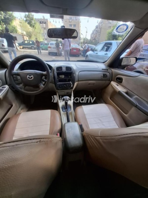 مازدا 323 1999 أسود أوتوماتيك مستعملة للبيع في القاهرة - 8