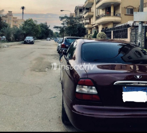 دايو ليوجانزا 1999 أحمر غامق أوتوماتيك مستعملة للبيع في العبور - 2