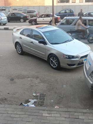 ميتسوبيشي لانسر اى اكس شارك 2015 فضي أوتوماتيك مستعملة للبيع في المحلة