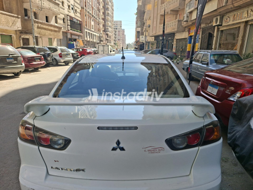 ميتسوبيشي لانسر 2016 أبيض أوتوماتيك مستعملة للبيع في القاهرة الكبرى ( القاهرة - الجيزة) - 3