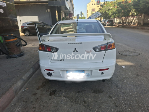 ميتسوبيشي لانسر 2016 أبيض أوتوماتيك مستعملة للبيع في القاهرة الكبرى ( القاهرة - الجيزة) - 4