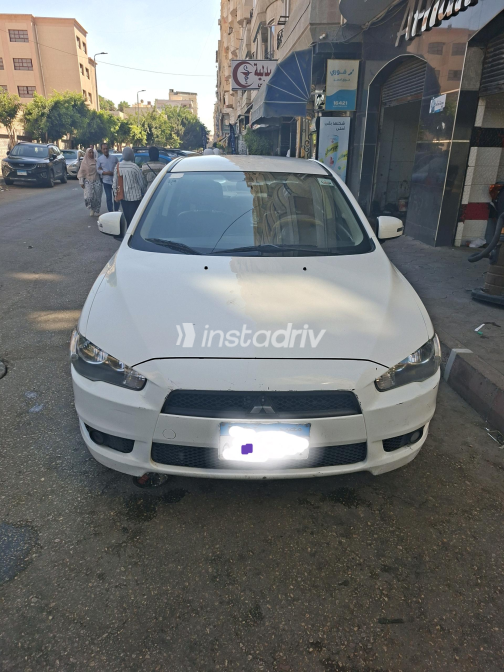 ميتسوبيشي لانسر 2016 أبيض أوتوماتيك مستعملة للبيع في القاهرة الكبرى ( القاهرة - الجيزة) - 10