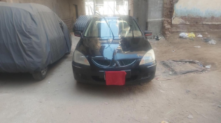 ميتسوبيشي لانسر 2006 أسود أوتوماتيك مستعملة للبيع في الغربية