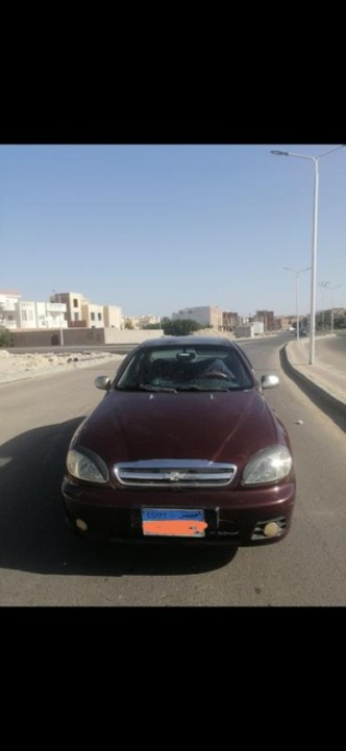 شيفروليه لانوس 2011 أحمر غامق أوتوماتيك مستعملة للبيع في الغردقة