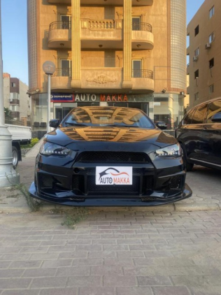 ميتسوبيشي لانسر 2016 أسود أوتوماتيك مستعملة للبيع في 6 أكتوبر