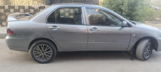 Mitsubishi Lancer Puma 2013 White Automatic Used for Sale in Cairo