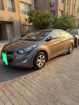 هيونداي إلنترا ام دى 2013 برونزي أوتوماتيك مستعملة للبيع في القاهرة الكبرى ( القاهرة - الجيزة)