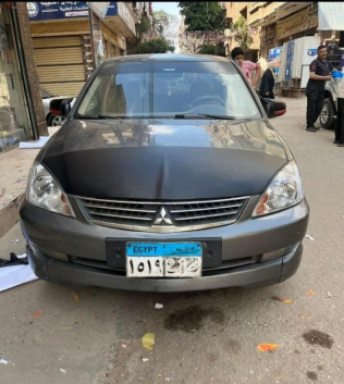 ميتسوبيشي لانسر 2007 أبيض أوتوماتيك مستعملة للبيع في العاشر من رمضان