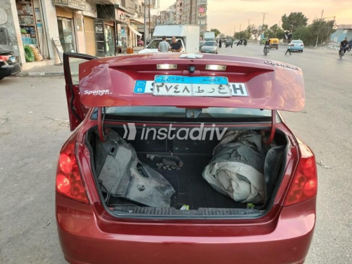 شيفروليه أوبترا 2009 أحمر غامق أوتوماتيك مستعملة للبيع في الإسكندرية - 3