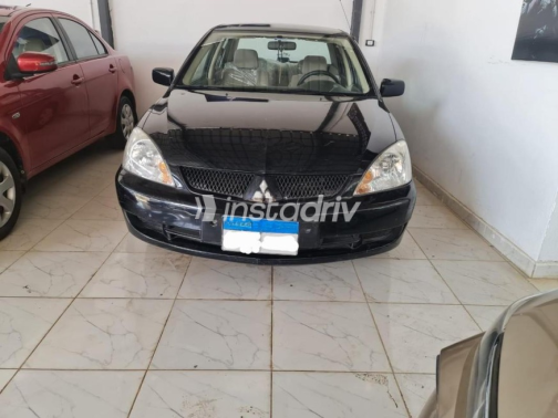 Mitsubishi Lancer Puma 2010 Black Manual Used for Sale in El Minya - 1
