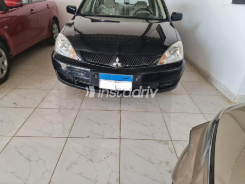 Mitsubishi Lancer Puma 2010 Black Manual Used for Sale in El Minya - 2