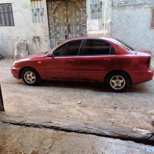دايو لانوس 2003 برونزي يدوي مستعملة للبيع في المنصورة