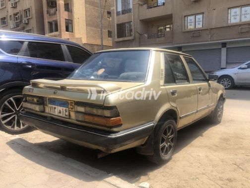 Mazda 323 1982 Gold Manual Used for Sale in Nasr city - 1