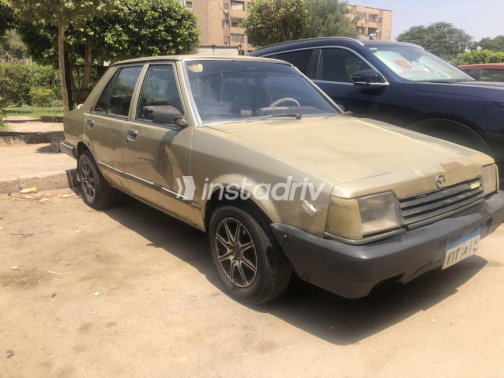 Mazda 323 1982 Gold Manual Used for Sale in Nasr city - 2