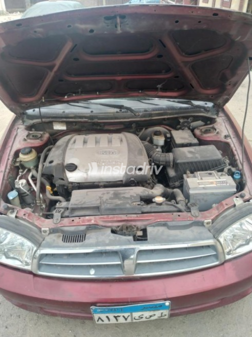 Kia Spectra 2003 Dark Red Manual Used for Sale in Ismailia - 7