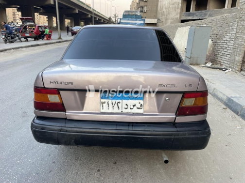 هيونداي اكسيل 1996 ذهبي يدوي مستعملة للبيع في مصر الجديدة - 4