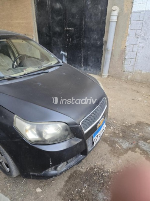 Chevrolet Aveo 2014 Black Automatic Used for Sale in Sheikh Zayed City - 5