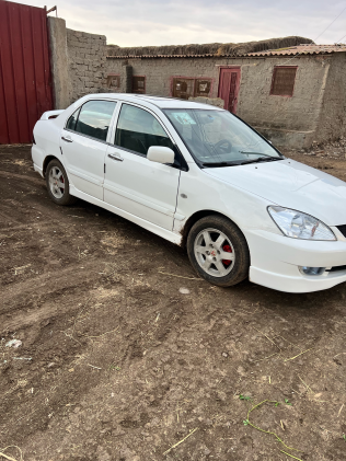 Mitsubishi Lancer Puma 2009 White Automatic Used for Sale in Greater Cairo ( Cairo + Giza)