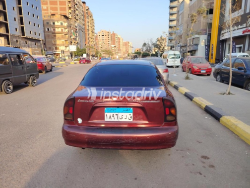 شيفروليه لانوس 2013 أحمر غامق يدوي مستعملة للبيع في بنها - 8
