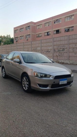 ميتسوبيشي لانسر 2015 فضي أوتوماتيك مستعملة للبيع في مصر الجديدة