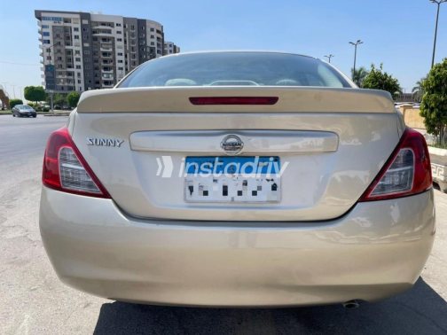 Nissan Sunny 2015 Gold Manual Used for Sale in Nasr city - 7