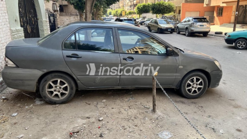Mitsubishi Lancer Puma 2006 Dark Gray Manual Used for Sale in Nasr city - 3