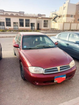 Kia Spectra 2004 Dark Red Manual Used for Sale in Cairo