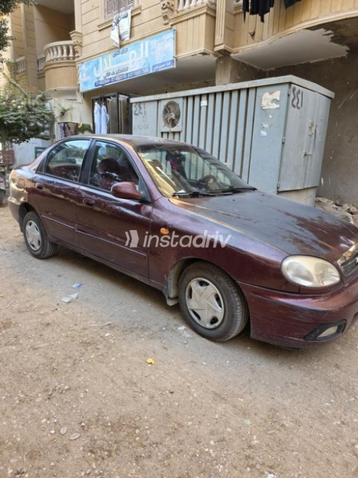 شيفروليه لانوس 2010 أحمر غامق يدوي مستعملة للبيع في الجيزة - 1