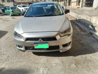 ميتسوبيشي لانسر 2016 برونزي أوتوماتيك مستعملة للبيع في المعادى
