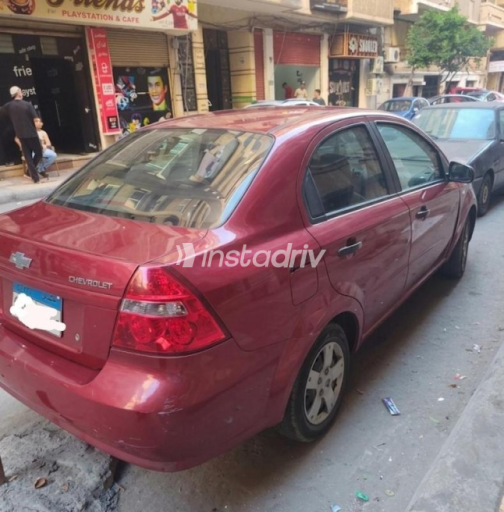 شيفروليه افيو 2014 أحمر يدوي مستعملة للبيع في الإسكندرية - 2