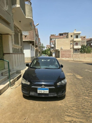 ميتسوبيشي لانسر اى اكس شارك 2015 أسود أوتوماتيك مستعملة للبيع في السويس‎