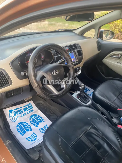 Kia Rio 2013 Orange Automatic Used for Sale in Greater Cairo ( Cairo + Giza) - 3