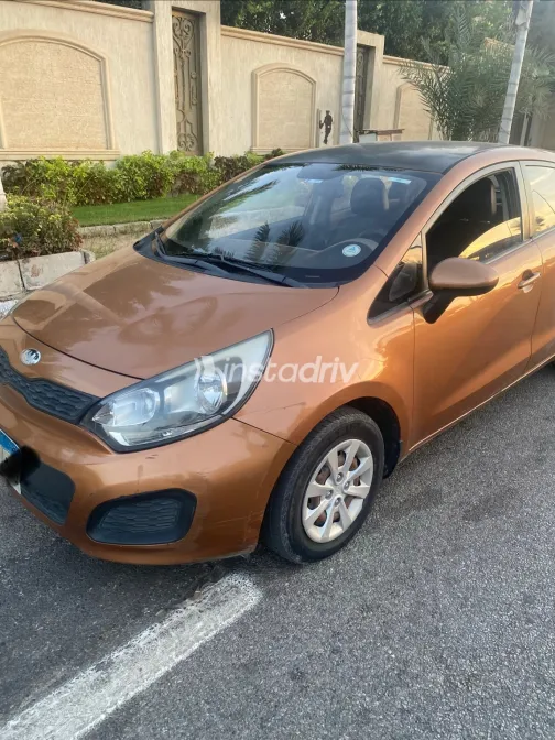 Kia Rio 2013 Orange Automatic Used for Sale in Greater Cairo ( Cairo + Giza) - 6