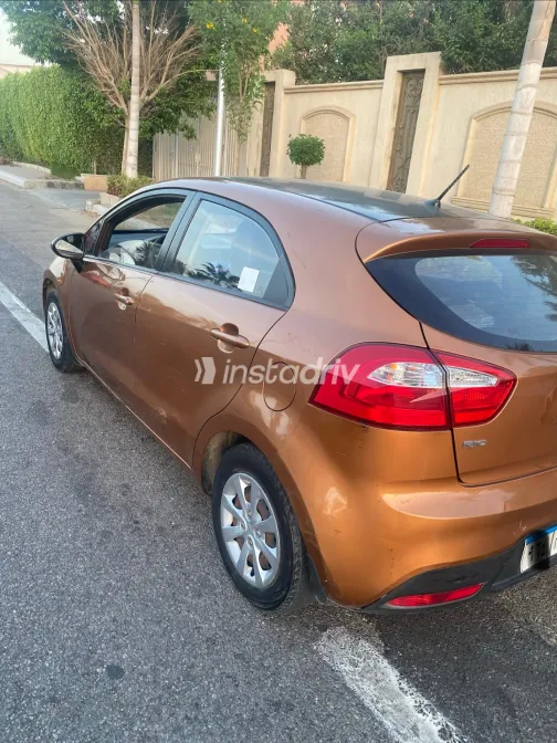Kia Rio 2013 Orange Automatic Used for Sale in Greater Cairo ( Cairo + Giza) - 7