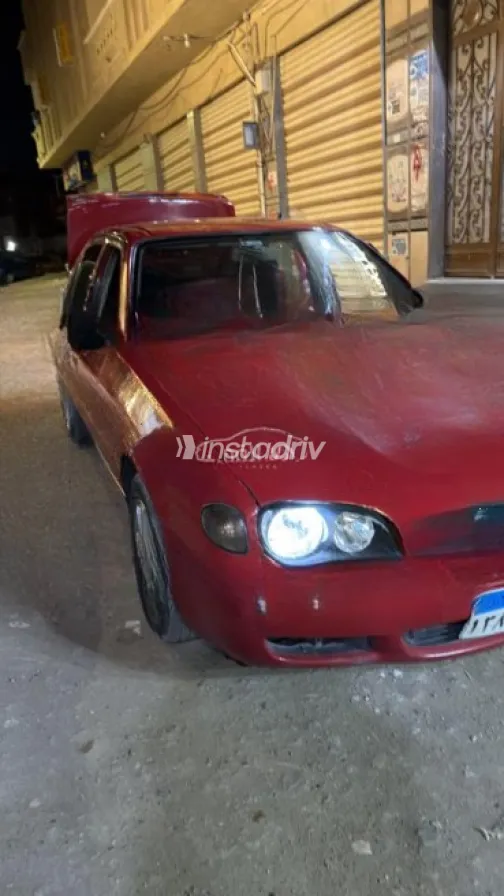 تويوتا كورولا 2000 أحمر يدوي مستعملة للبيع في دمنهور - 3