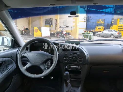 Mitsubishi Mirage 1999 White Manual Used for Sale in Greater Cairo ( Cairo + Giza) - 5