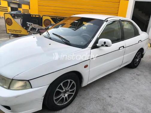 Mitsubishi Mirage 1999 White Manual Used for Sale in Greater Cairo ( Cairo + Giza) - 8