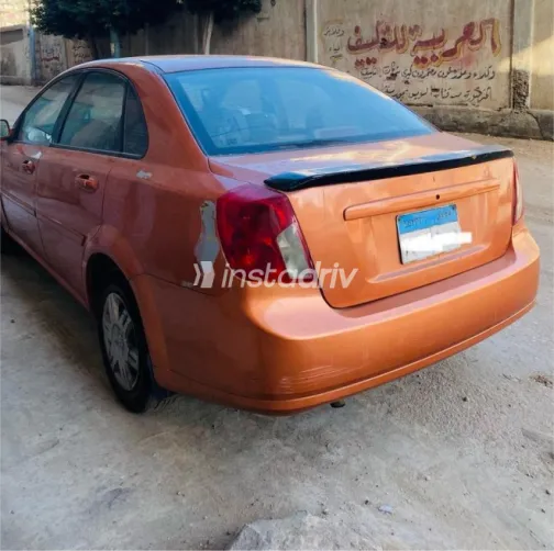 Chevrolet Optra 2005 Orange Automatic Used for Sale in Mansoura - 4
