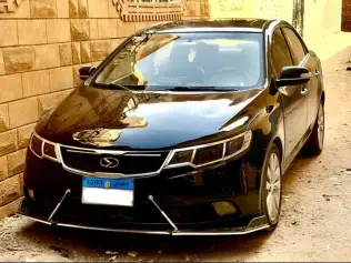 كيا سيراتو 2011 أسود أوتوماتيك مستعملة للبيع في طوخ